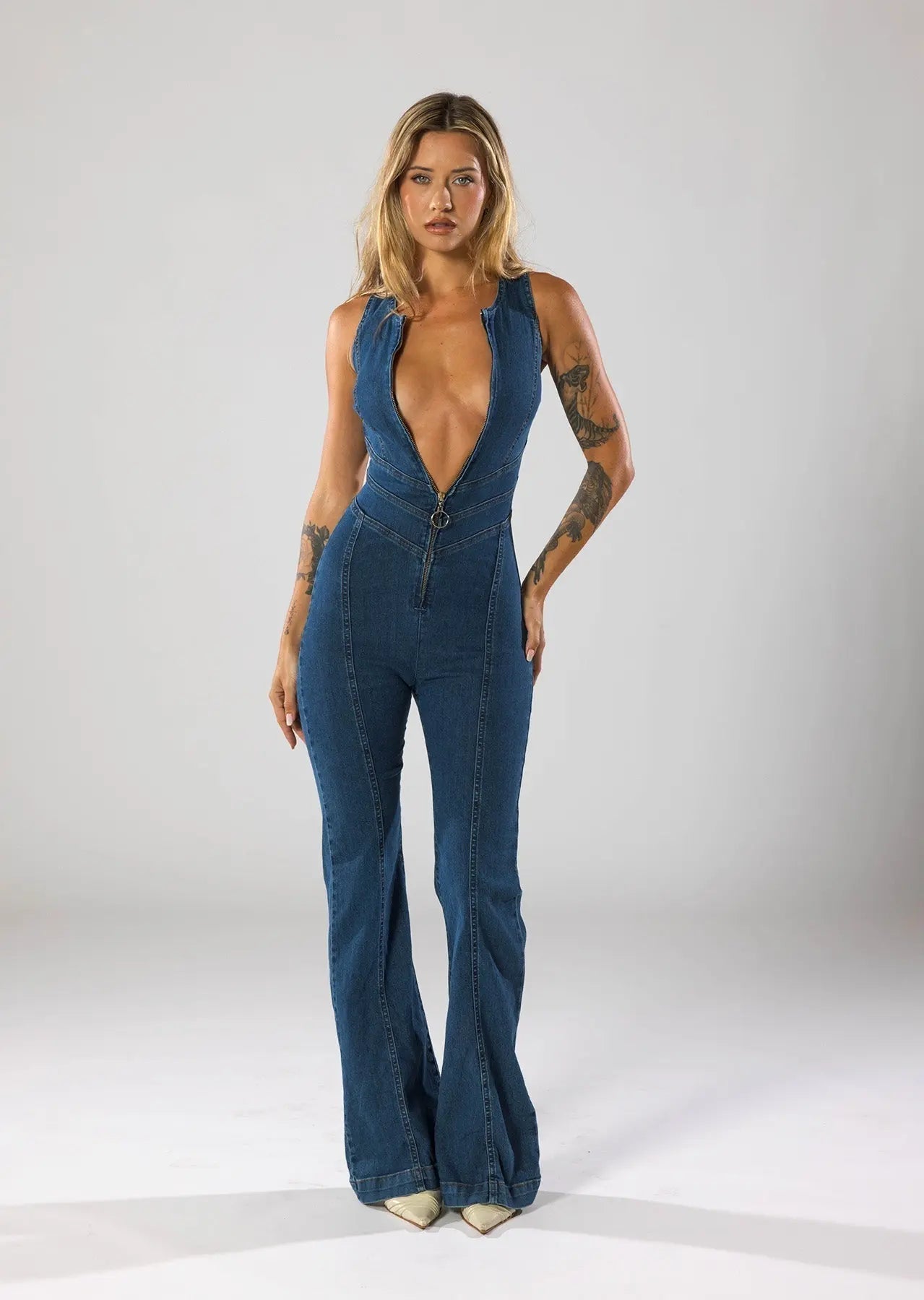 Flared Leg Denim Jumpsuit with Deep V-Neck