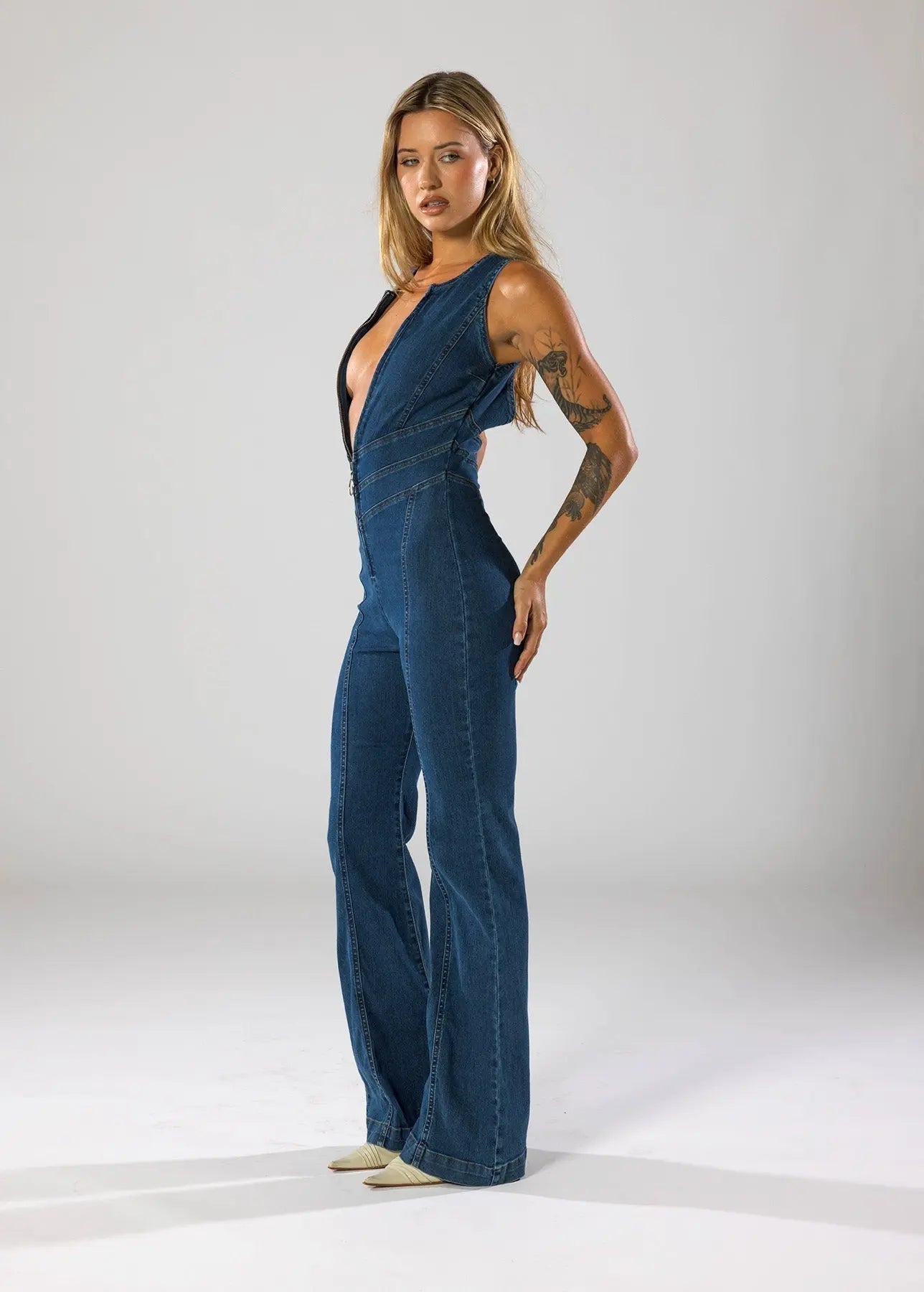 Flared Leg Denim Jumpsuit with Deep V-Neck