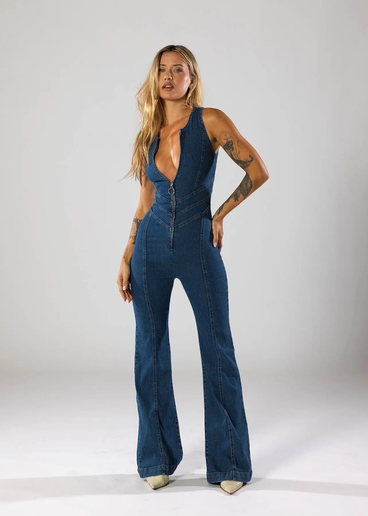 Flared Leg Denim Jumpsuit with Deep V-Neck