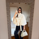 Sophisticated Belted Cape Jacket with High Neck